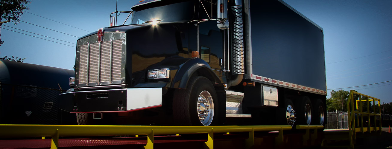 large truck being weighed on a truck scale