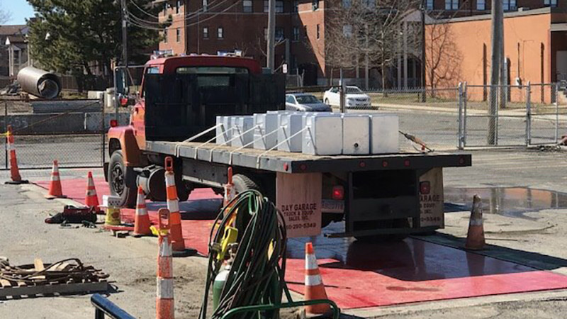 Large truck being weighed on a truck scale installed by Able Scale